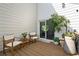 An outdoor wooden deck with seating and lush green plants at 2210 Spear Point Dr, Marietta, GA 30062