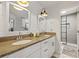 Bathroom with granite double vanity, modern lighting and large glass enclosed shower at 2210 Spear Point Dr, Marietta, GA 30062