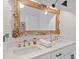 Elegant bathroom featuring double sinks, quartz countertops, and an ornate gold mirror at 2210 Spear Point Dr, Marietta, GA 30062