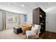 Comfortable bedroom with a view, storage, and a seating area at 2210 Spear Point Dr, Marietta, GA 30062