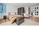 Bedroom with neutral tones, cozy rug, shoe storage, and decor at 2210 Spear Point Dr, Marietta, GA 30062