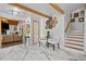 Open-concept home foyer flows into the living room and staircase, accented by stylish marble floors and wood trim at 2210 Spear Point Dr, Marietta, GA 30062