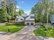 Charming two story white home boasts a well-manicured lawn and an inviting exterior, complete with a spacious driveway at 2210 Spear Point Dr, Marietta, GA 30062
