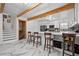 Large kitchen featuring stainless steel appliances, a large island, bar seating, and marble floors at 2210 Spear Point Dr, Marietta, GA 30062