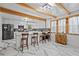 Modern kitchen featuring a large island, white cabinets, stainless steel appliances, and marble floors at 2210 Spear Point Dr, Marietta, GA 30062