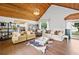 Inviting living room with vaulted wood ceilings, stylish decor, and lots of natural light at 2210 Spear Point Dr, Marietta, GA 30062