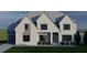 Beautiful two-story home boasts a gray brick exterior, multiple windows, and a well-maintained lawn at 2856 Octavia Cir, Marietta, GA 30062
