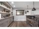 Stylish home bar with shelving and cabinets for beverage storage and entertaining at 365 Freeman Sw Ter, Atlanta, GA 30331