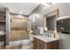 Beautiful bathroom featuring modern fixtures, tile shower with glass door, and stylish vanity at 365 Freeman Sw Ter, Atlanta, GA 30331