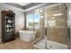 Bathroom featuring a glass shower, tub, and cabinet at 365 Freeman Sw Ter, Atlanta, GA 30331