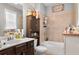 Bathroom featuring a bath tub, tile wall, toilet, and vanity with sink at 365 Freeman Sw Ter, Atlanta, GA 30331