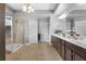 Bathroom featuring a glass shower and double vanity sink at 365 Freeman Sw Ter, Atlanta, GA 30331