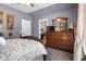 Cozy bedroom with neutral tones, natural light, dark furniture, and ample closet space at 365 Freeman Sw Ter, Atlanta, GA 30331