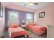 Charming bedroom with twin beds, colorful bedding, and natural light at 365 Freeman Sw Ter, Atlanta, GA 30331