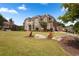 Elegant brick home with manicured lawn and charming butterfly garden decor at 365 Freeman Sw Ter, Atlanta, GA 30331