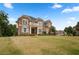 Stately brick home with a well-manicured lawn and balcony, showcasing classic elegance at 365 Freeman Sw Ter, Atlanta, GA 30331