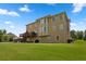 A sprawling lawn and multi-level back elevation of a home with deck and manicured yard at 365 Freeman Sw Ter, Atlanta, GA 30331