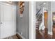 Well-lit entryway featuring hardwood floors, a white door, and staircase access at 365 Freeman Sw Ter, Atlanta, GA 30331