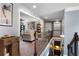 Hallway leading to a cozy living room with stairs to lower level, showcasing open floor plan at 365 Freeman Sw Ter, Atlanta, GA 30331