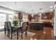 Spacious kitchen with dark wood cabinetry, granite countertops, and a large island at 365 Freeman Sw Ter, Atlanta, GA 30331