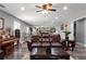 Spacious living room with hardwood floors, a large leather sofa, and a piano at 365 Freeman Sw Ter, Atlanta, GA 30331