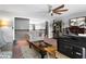 Relaxing living room with a cozy patterned chair, entertainment, and natural light at 365 Freeman Sw Ter, Atlanta, GA 30331