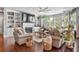 Bright and spacious living room with fireplace and built-in shelving and large windows at 365 Freeman Sw Ter, Atlanta, GA 30331