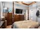 Bedroom featuring a four-poster bed, two dressers, and a wall-mounted television at 365 Freeman Sw Ter, Atlanta, GA 30331