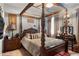A stately bedroom features a four-post bed, a vanity, and an ornate mirror at 365 Freeman Sw Ter, Atlanta, GA 30331