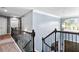 Staircase with railing and carpet and a view to the entry at 365 Freeman Sw Ter, Atlanta, GA 30331