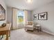Comfortable bedroom featuring natural light and a cozy armchair at 5641 Hislop Ln # 88, Mableton, GA 30126