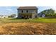 Spacious backyard with a covered patio and ample space for outdoor activities at 61 N Village Cir, Rydal, GA 30171