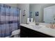 Bathroom features a shower with stylish curtain and white countertop vanity at 61 N Village Cir, Rydal, GA 30171