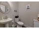 Half-bath features a sleek pedestal sink and modern fixtures at 61 N Village Cir, Rydal, GA 30171