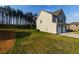 Lovely home with a two-car garage and a spacious, well-manicured lawn at 61 N Village Cir, Rydal, GA 30171