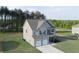 Beautiful two-story home with a two-car garage and well-maintained landscaping at 61 N Village Cir, Rydal, GA 30171