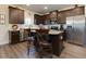 Stylish kitchen with dark wood cabinetry, stainless appliances, and a central island with bar stools at 61 N Village Cir, Rydal, GA 30171