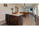 Well-lit kitchen island with seating and drawers, blending seamlessly into the dining and living spaces at 61 N Village Cir, Rydal, GA 30171