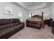 Spacious main bedroom features trey ceilings and a comfortable seating area at 61 N Village Cir, Rydal, GA 30171