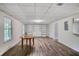 Finished basement offers built in shelving, gray vinyl plank flooring and abundant natural light at 680 Ruxbury Ct, Suwanee, GA 30024