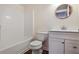 Clean bathroom featuring a tub and shower combination and a modern vanity with stylish hardware at 680 Ruxbury Ct, Suwanee, GA 30024