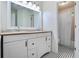 Classic bathroom with a double sink vanity, large mirror, and a separate shower/tub area at 680 Ruxbury Ct, Suwanee, GA 30024