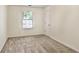 Standard bedroom with neutral walls and carpet, with a window offering natural light at 680 Ruxbury Ct, Suwanee, GA 30024