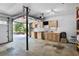 Organized garage workspace features custom cabinets, a work bench, and plenty of room for storage at 680 Ruxbury Ct, Suwanee, GA 30024