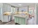 Updated kitchen featuring stainless steel appliances, a kitchen island, and sleek countertops at 680 Ruxbury Ct, Suwanee, GA 30024