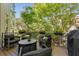 Outdoor seating area with lush greenery providing privacy and shade at 1954 Saxon Valley Ne Cir, Brookhaven, GA 30319