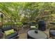 Outdoor seating area with comfortable chairs and grill at 1954 Saxon Valley Ne Cir, Brookhaven, GA 30319