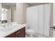 Bathroom with white sink, vanity, toilet, and shower with neutral wall paint at 1954 Saxon Valley Ne Cir, Brookhaven, GA 30319