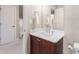 Bright bathroom features a white sink, vanity, towel rack, and toilet at 1954 Saxon Valley Ne Cir, Brookhaven, GA 30319