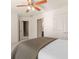 View of the bedroom with neutral walls, a ceiling fan, and doorway access at 1954 Saxon Valley Ne Cir, Brookhaven, GA 30319